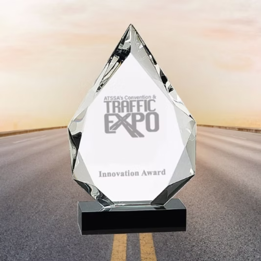 ATSSA's Traffic Expo Award with paved street and sunset in the background